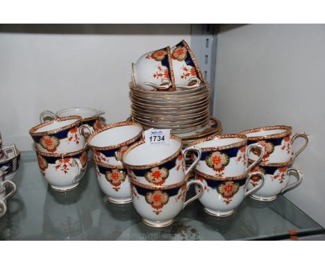 A Royal Albert 'Wembley' pattern Teaset including twelve cups and saucers, eleven tea plates, two bread and butter, slop bowl