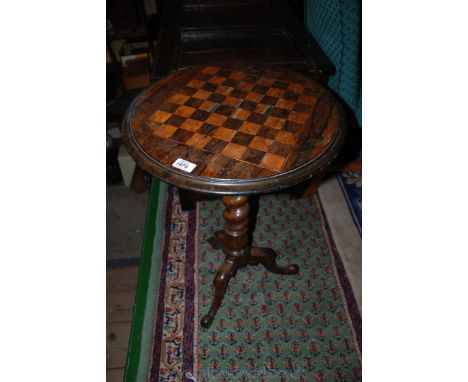 A 19th c. occasional Games Table, having circular Mahogany top with Rosewood and Satinwood Chess/Draught board top, on taperi