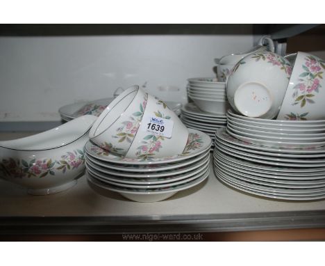 A Tea and Dinner Service by Johnson Bros in ''Snow White'' design and comprising six Cups and saucers, twelve Side Plates, fi