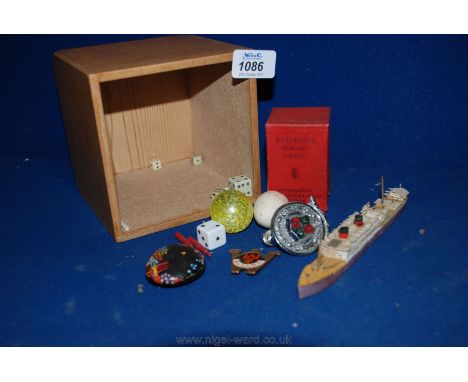 A small box of interesting collectables including a Manchester United badge from the 1970's, bone dies and markers, twin pack