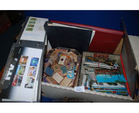 A quantity of matchboxes, box folder of modern Postcards and folder of first day Covers of 1970's and 80's, etc.