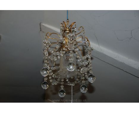 A pretty period small crystal Chandelier with faceted bead garlands surrounding a cut glass bell shaped centre and having six