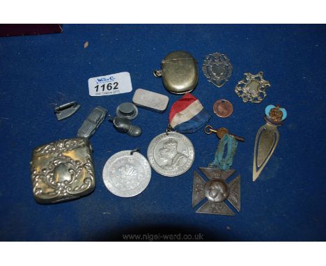 A quantity of miscellanea including commemorative Medals, plated Vesta Cases, Silver Fob, Metal Monopoly Game pieces, etc.