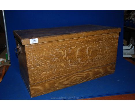 A German Child's Pine Trunk with original decorative faux wood grain paint finish on the outside.
