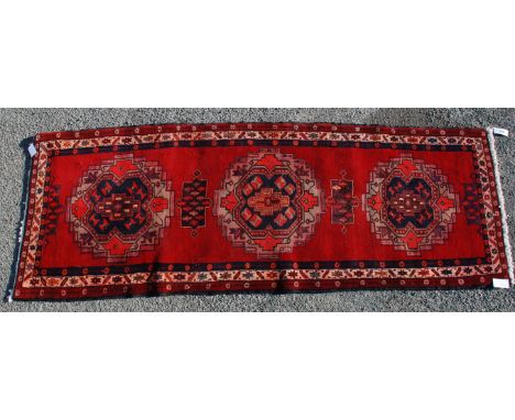 A North West Persia good Bijar Carpet, the rust field with numerous tribal motifs and stylized humanoid motifs centred by a c