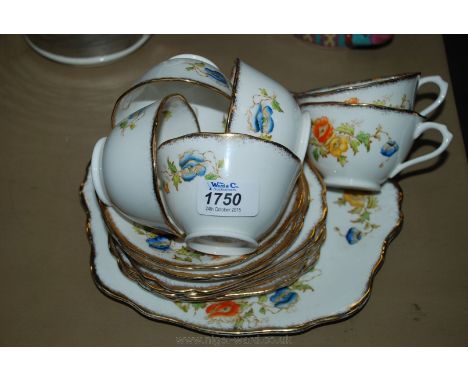 A Royal Albert Crown China part Teaset including six cups and tea plates, three saucers and bread and butter plate.