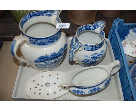 Two blue and white Jugs one with hunting scene design, the other depicting cattle drinking at a river, a blue and white Gravy