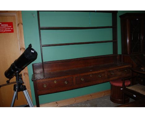 A Georgian Oak Dresser Base, having two plank top with upstand  back and reeded edges, three Pine lined frieze drawers with c