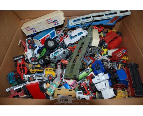 A box containing Dinky Toys including Car Transporter, Camper Van, Range Rover, Tractor, London Bus, etc.