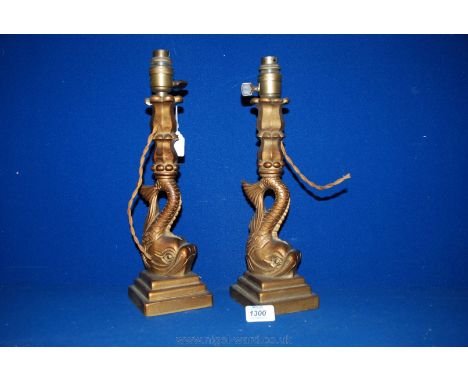 A pair of arts and crafts, hand carved gilt wood Lamp bases in the form of Dolphins.  14'' tall.