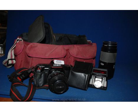 A Minolta 5000 Camera with 35-70 mm lens, along with a Minolta 70-210 mm lens, Flash Unit, etc. in soft red camera bag.