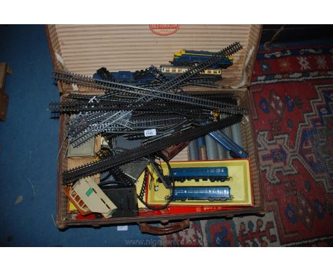 A wooden bound Trunk with contents including Triang Train set, track, Engines, Carriages, Buildings, Transformer, etc.