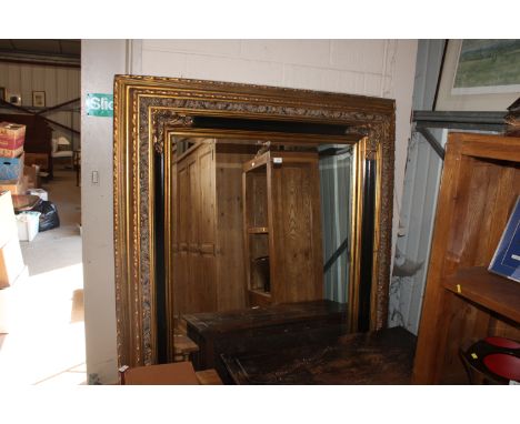 A large gilt framed bevel edged mirror, 137cm x 170cm in extremes 