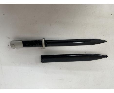 A NAZI GERMANY WWII S 84/98 BAYONET AND SCABBARD, 25CM BLADE, SCABBARD DATED 1940, LENGTH 40.5CM.PROVENANCE: THIS LOT HAS BEE