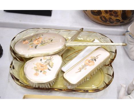 A VINTAGE DRESSING TABLE BRUSH TO INCLUDE, GLAS TRAY, TWO BRUSHES, A MIRROR AND COMB, WITH EMBROIDERED BACKS 