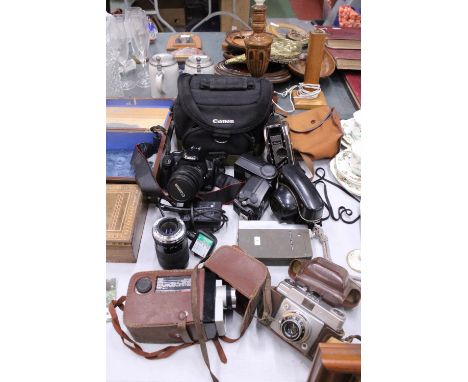 A COLLECTION OF CAMERAS TO INCLUDE A CANON EOS WITH BATTERY PACK, LENS AND BAG, PLUS A VINTAGE ILFORD AND KODAK, CINE CAMS, E