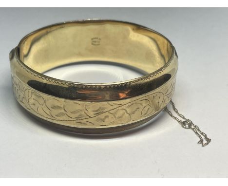 A GOLD PLATED BANGLE 