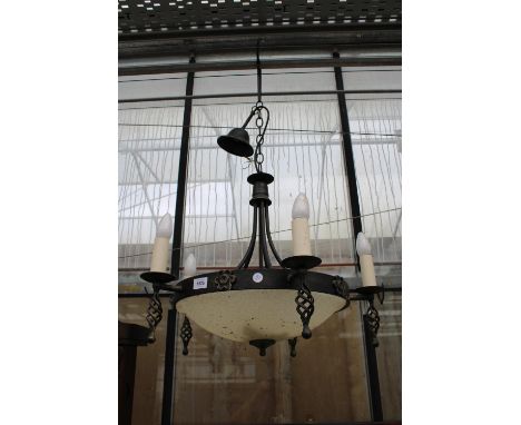 A DECORATIVE WROUGHT IRON FIVE BRANCH CIELING LIGHT FITTINGS WITH GLASS BOWL SHADE 