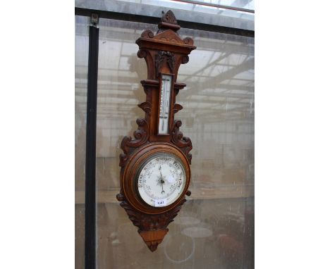 A VINTAGE OAK CASED BAROMETER 