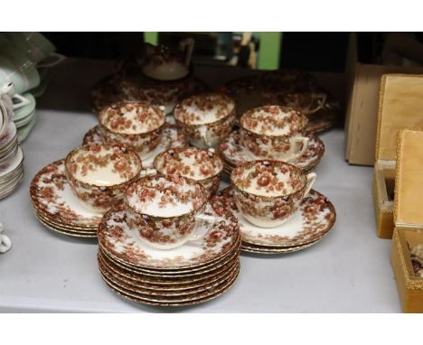 A VINTAGE FLORAL TEASET TO INCLUDE CAKE PLATES, A SUGAR BOWL, CREAM JUG, CUPS, SAUCERS AND SIDE PLATES 