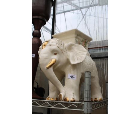 A DECORATIVE CERAMIC ELEPHANT JARDINAIRE STAND 