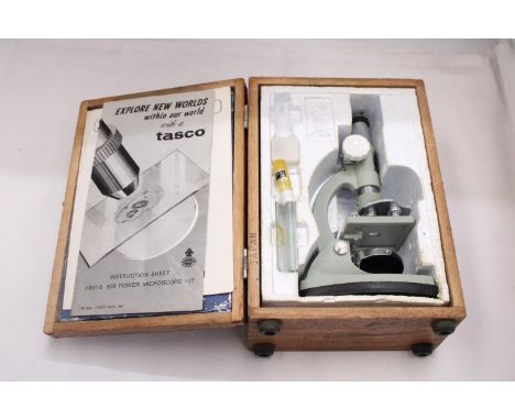 A VINTAGE, BOXED, TASCO MICROSCOPE WITH INSTRUCTIONS 