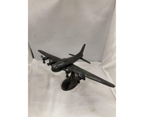A LARGE METAL FOUR ENGINE AMERICAN BOMBER PLANE 