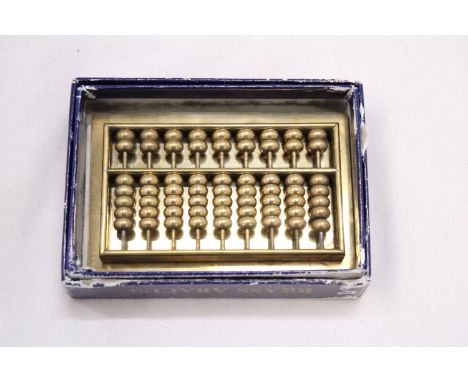 A SMALL VINTAGE HEAVY BRASS ABACUS 
