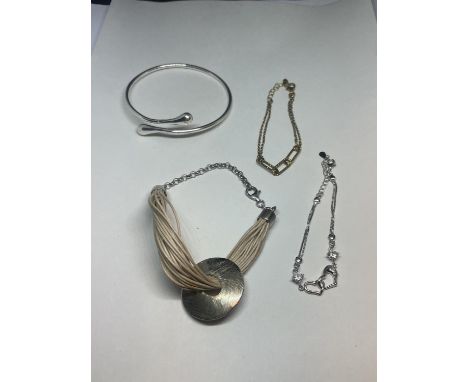 THREE SILVER BRACELETS AND A SILVER BANGLE 