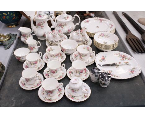 A ROYAL DOULTON 'MOSS ROSE' TEASET TO INCLUDE A TEAPOT AND COFFEE POT, PLATES, CREAM JUGS, A CAKE PLATE, SUGAR BOWL, CUPS, SA