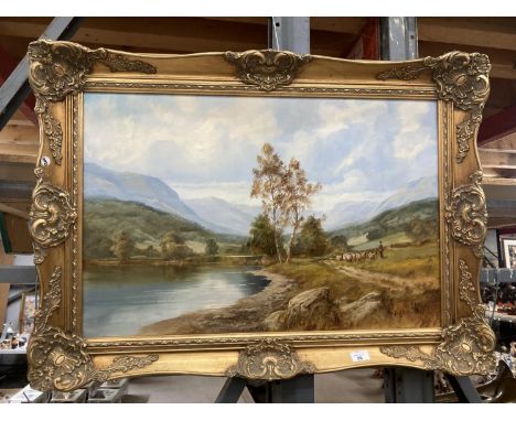 A GILT FRAMED OIL ON CANVAS OF A LAKE SCENE WITH A FARMER MOVING STOCK SIGNED JACK R MOULD TO LOWER RIGHT HAND CORNER 19.5" X