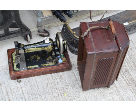 A VINTAGE SINGER SEWING MACHINE WITH WOODEN CARRY CASE 