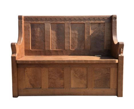 WORKSHOP OF ROBERT 'MOUSEMAN' THOMPSON (BRITISH, 1876-1955), an oak box bench, with arcaded back, of panelled construction, t