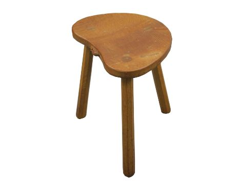 ROBERT 'MOUSEMAN' THOMPSON (BRITISH, 1876-1955), a three legged oak stool, 45cm high 