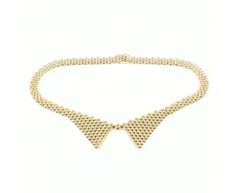 A vintage hallmarked 9ct yellow gold chain necklace. The chain comprised of panther links in the form of a blouses collar lap
