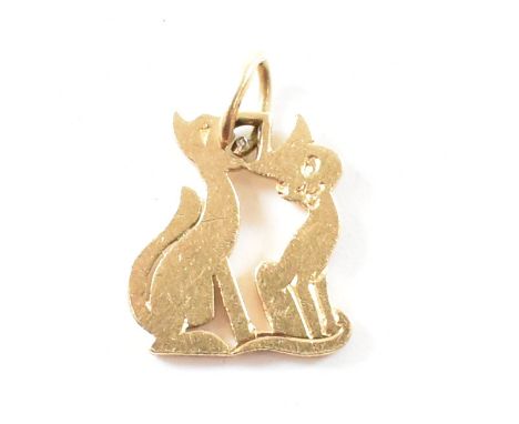 A vintage Cartier London gold pendant charm. The pendant in the form of cats with etched faces on pendant bale. Marked Cartie