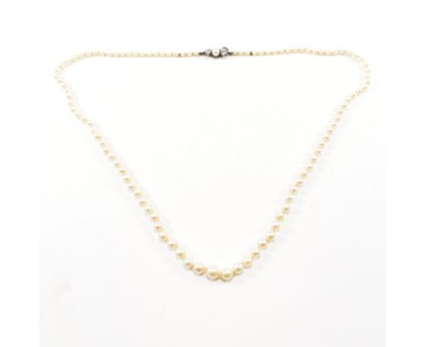 An early 20th century cultured pearl and spinel bead necklace. The necklace comprised of graduating rounded cultured pearls s