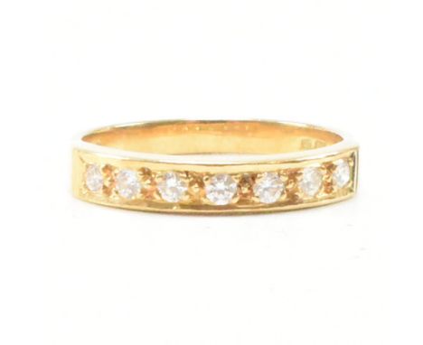 An 18ct gold and diamond half eternity ring. The ring set with seven round brilliant cut diamonds. Hallmarked for London. Est