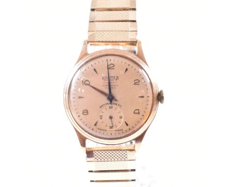 A hallmarked 9ct yellow gold cased Roamer Premier Dennison wristwatch. The watch having a circular champagne dial with mixed 