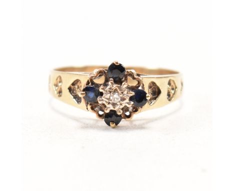 A vintage hallmarked 9ct yellow gold, sapphire and diamond cluster ring. The ring having a central illusion set round cut dia