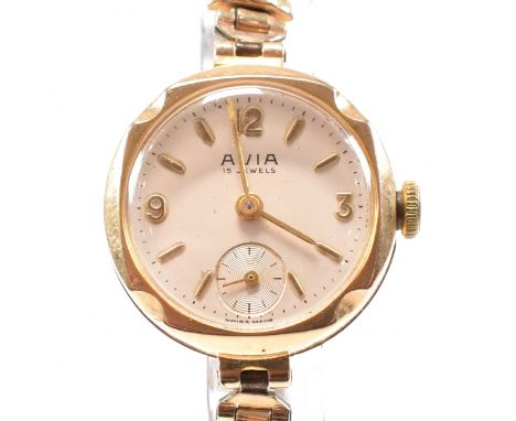 A 9ct gold Avia ladies15 jewel wristwatch. The watch with champagne dial. Arabic numeral and baton chapter ring with dagger h
