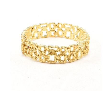 A vintage 18ct yellow gold articulated chain bracelet. The links comprised of brutalist style rectangular abstract links with