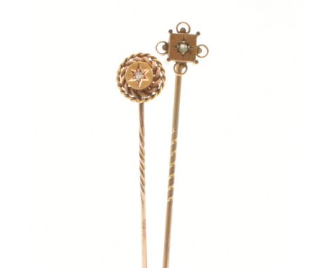 An antique 15ct yellow gold and diamond stick pin together with a yellow metal stick pin. The first having a round cut star s