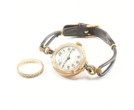 A vintage Gilbert &amp; Sons, Barrow and Coventry hallmarked 9ct gold 15 jewel watch AF and A 9ct gold eternity ring. The wat