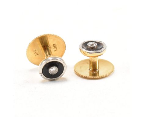 A pair of 18ct yellow gold, platinum and diamond dress buttons. The shirt studs each having a central round cut milgrain set 