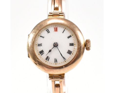 An early 20th century hallmarked 9ct gold wrist watch. The 15 jewel watch having an enamel dial with Roman numeral indices. T