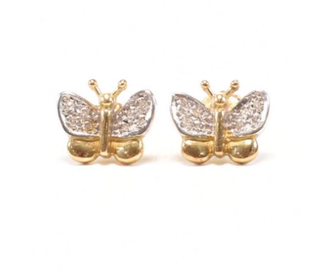 A pair of vintage hallmarked 18ct bi colour gold and diamond stud earrings. The two tone earrings in the form of yellow and w