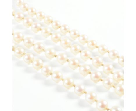 A vintage hallmarked 9ct yellow gold and cultured pearl bead necklace. Each uniform round white pearl spaced by knotted strin