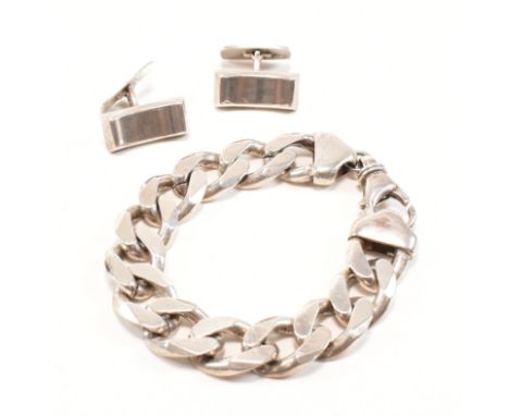 A vintage 925 silver bracelet chain with a pair of 925 silver cufflinks. The bracelet comprised of statement curb links unite