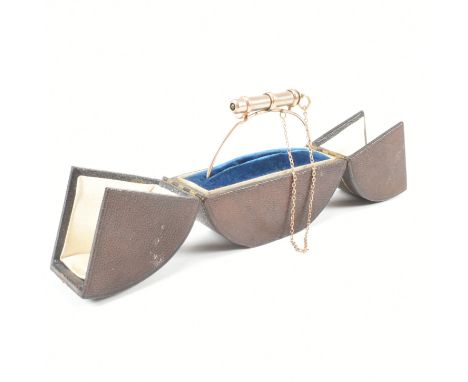 An antique S. Mordan &amp; Co propelling pencil bangle bracelet. The bangle of rose metal wire with hook and eye type clasp h